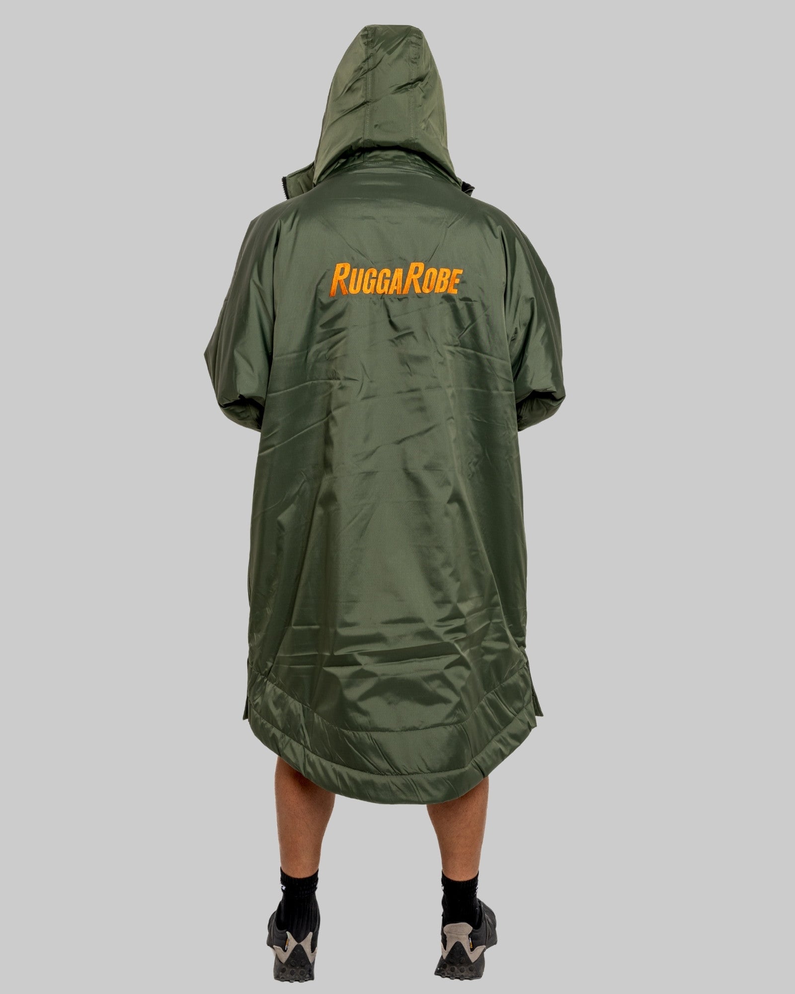 Green poncho with 'Rugga Robe' branding on a gray background