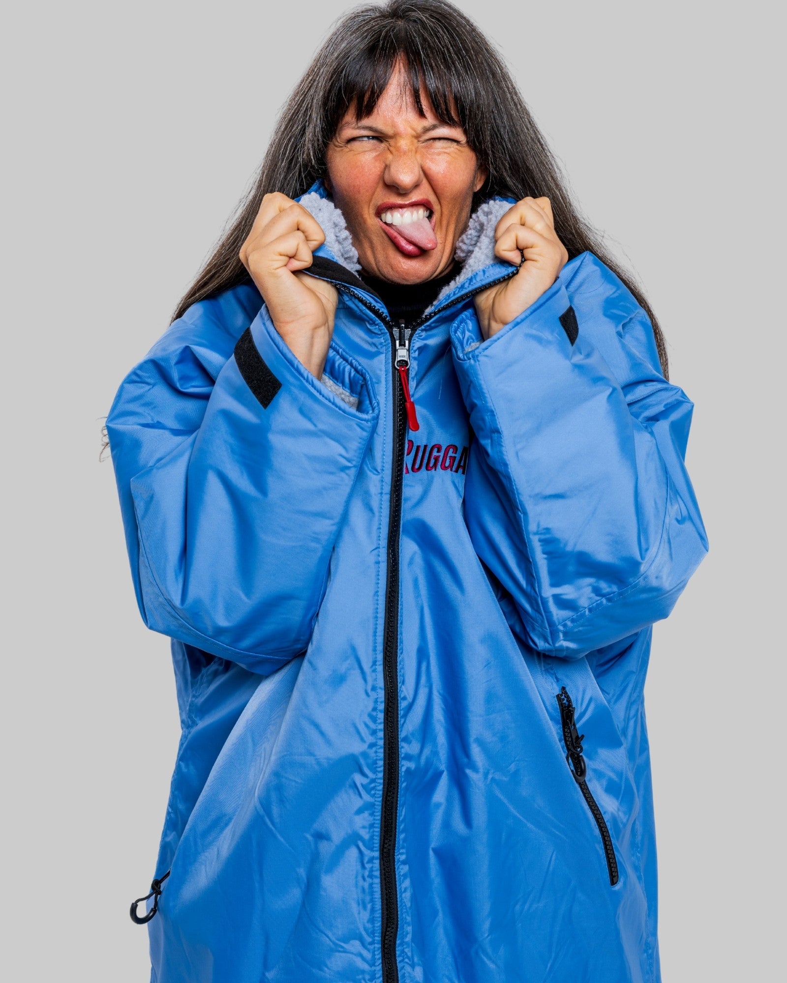 Model wearing a pale blue with grey feece ruggarobe on a gray background