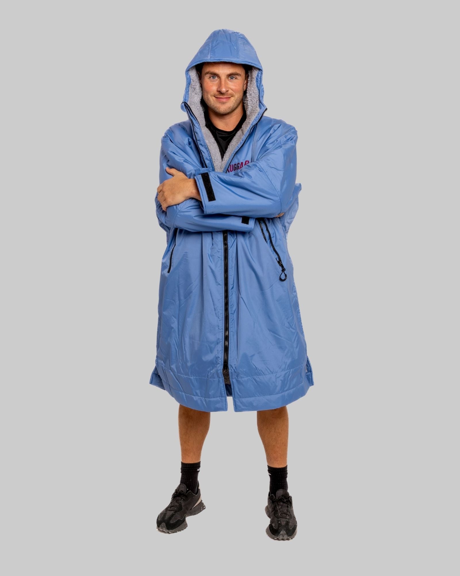 Model wearing a pale blue with grey feece ruggarobe on a gray background