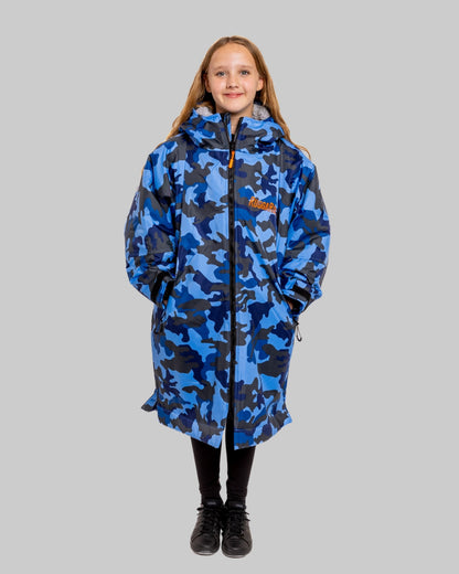 Model wearing RuggaRobe blue camo change robe with grey fleece interior on grey background