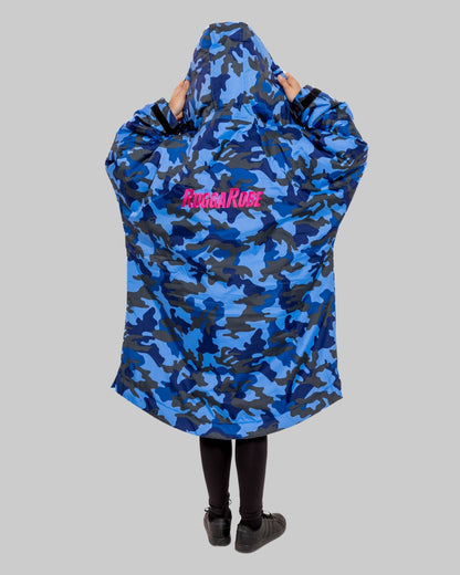 Model wearing RuggaRobe blue camo change robe with pink fleece interior on grey background