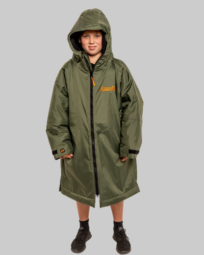 Model wearing RuggaRobe green change robe with black fleece interior on grey background