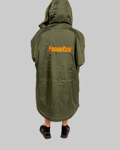 Model wearing RuggaRobe green change robe with black fleece interior on grey background