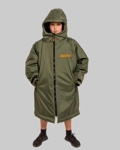 Model wearing RuggaRobe green change robe with black fleece interior on grey background