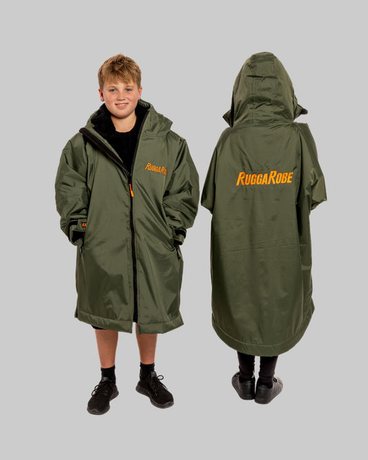 Person wearing a green RuggaRube raincoat with the brand name visible on a gray background