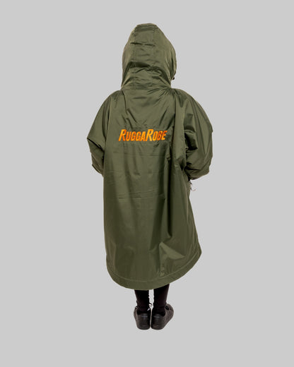 Model wearing RuggaRobe green change robe with black fleece interior on grey background