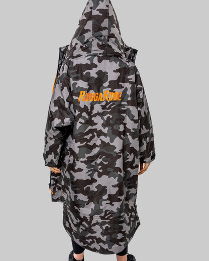 Model wearing RuggaRobe grey camo change robe with orange fleece interior on grey background