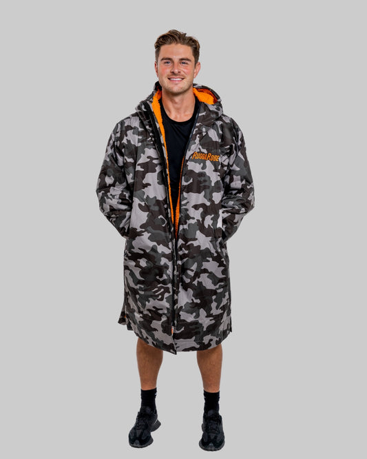 Model wearing RuggaRobe grey camo change robe with orange fleece interior on grey background