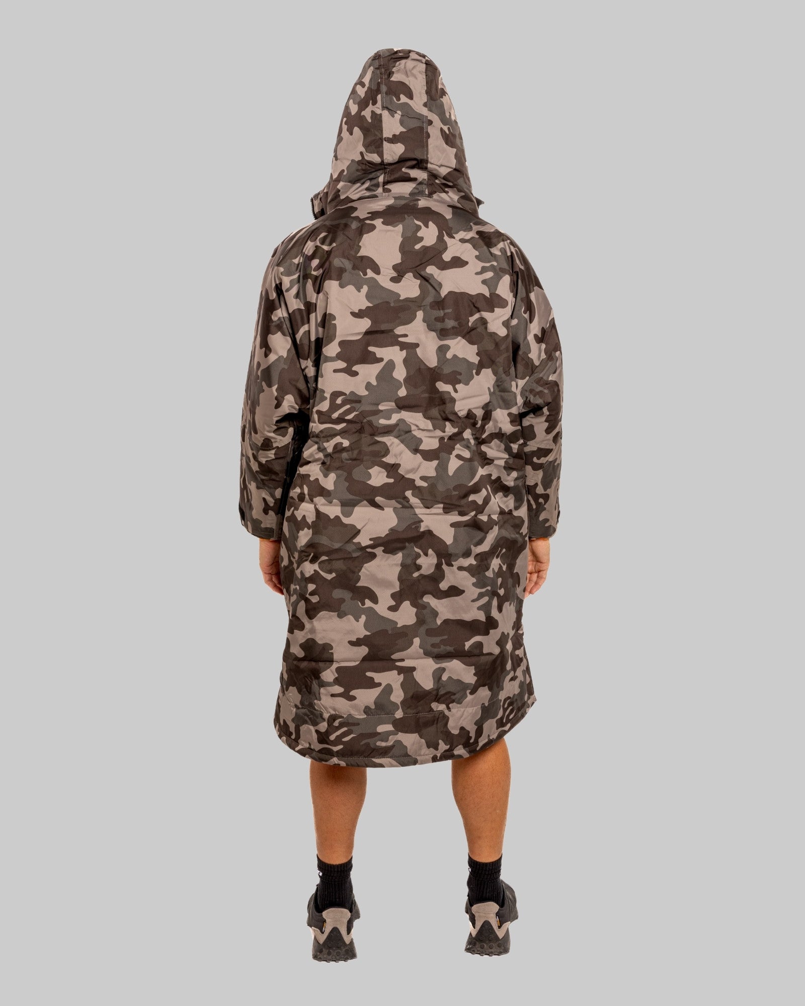 Model wearing RuggaRobe grey camo change robe with orange fleece interior on grey background
