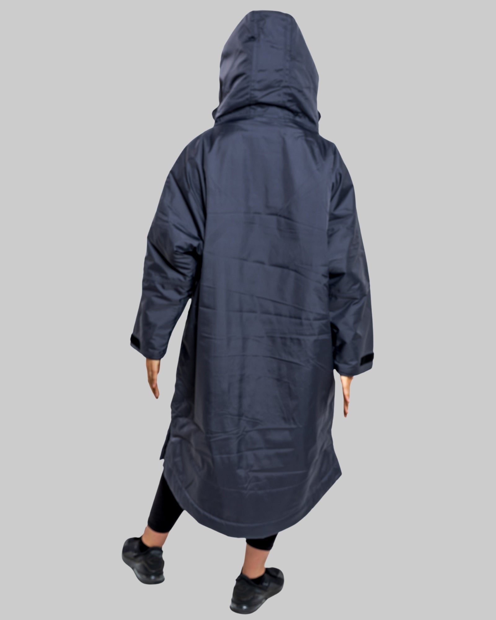 Model wearing RuggaRobe slate grey change robe with pink fleece interior on grey background