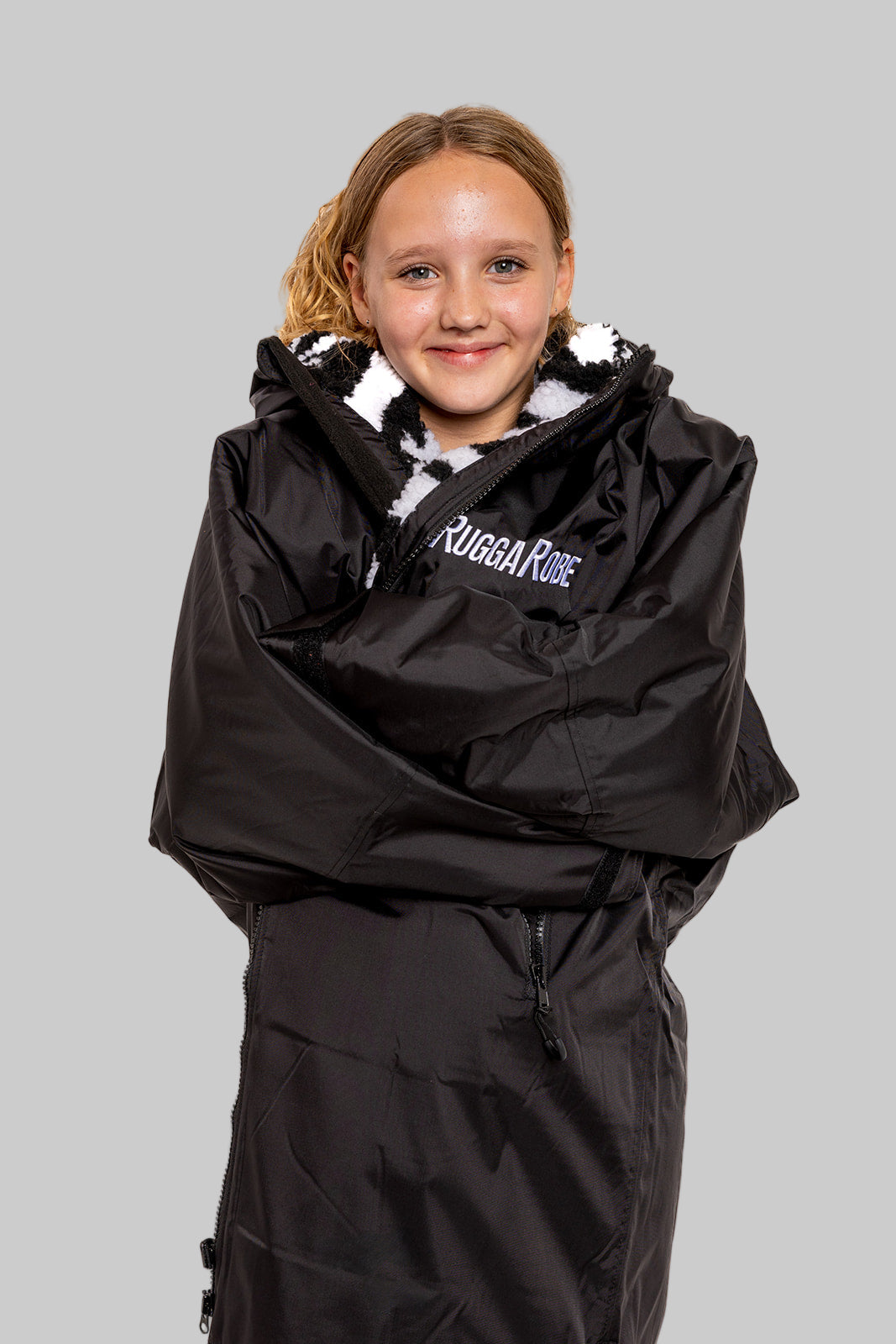 Model wearing RuggaRobe zebra  change robe on grey background